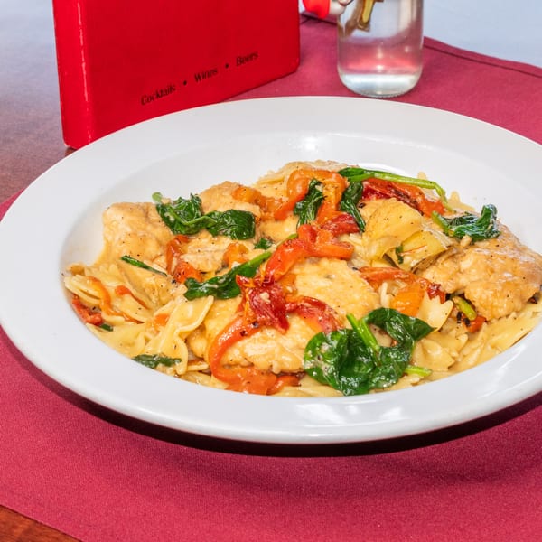 Sorrento Restaurant's Italian pasta dish with chicken, spinach, sun-dried tomatoes, and creamy sauce.